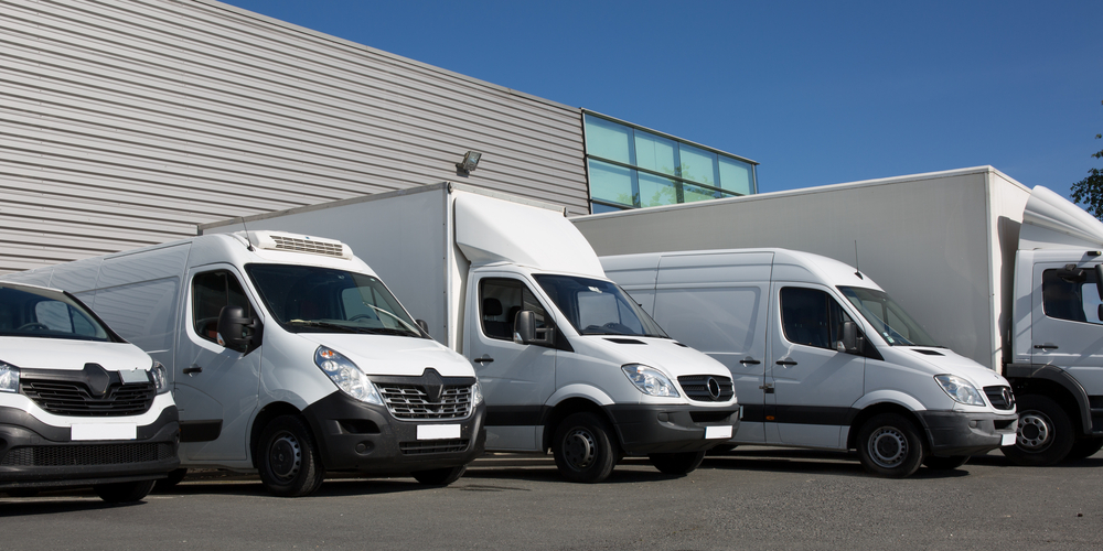 Row of shipping trucks and vans