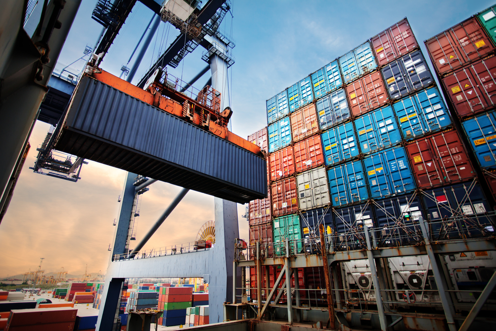 Cargo container being lifted onto a boat